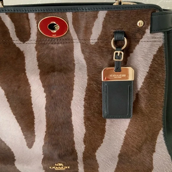 Coach,calf hair and leather top handle
Bag - Picture 3 of 14